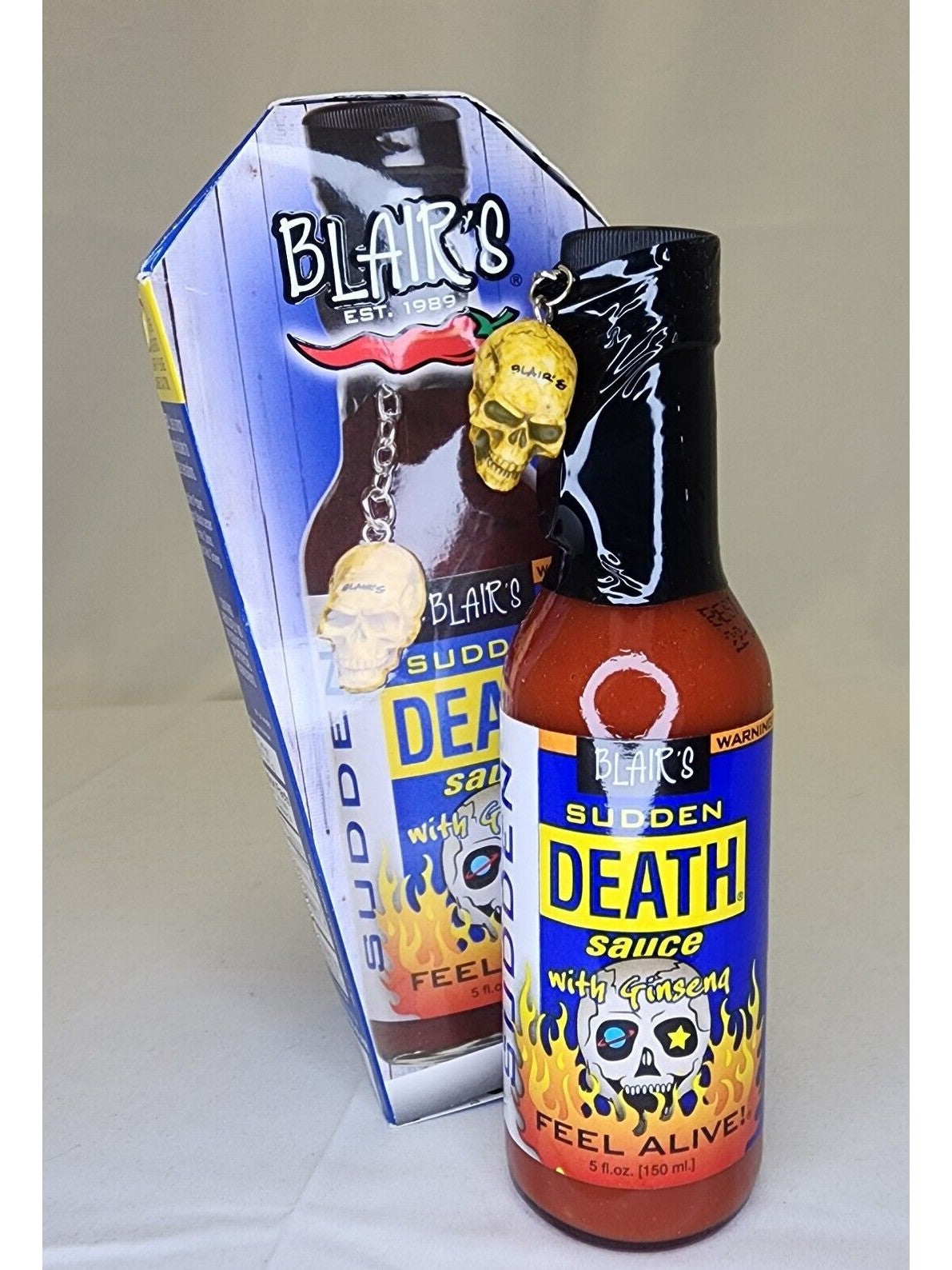 Hot Sauce Blair’s Sudden Death with Ginseng in a cardboard Coffin Skul